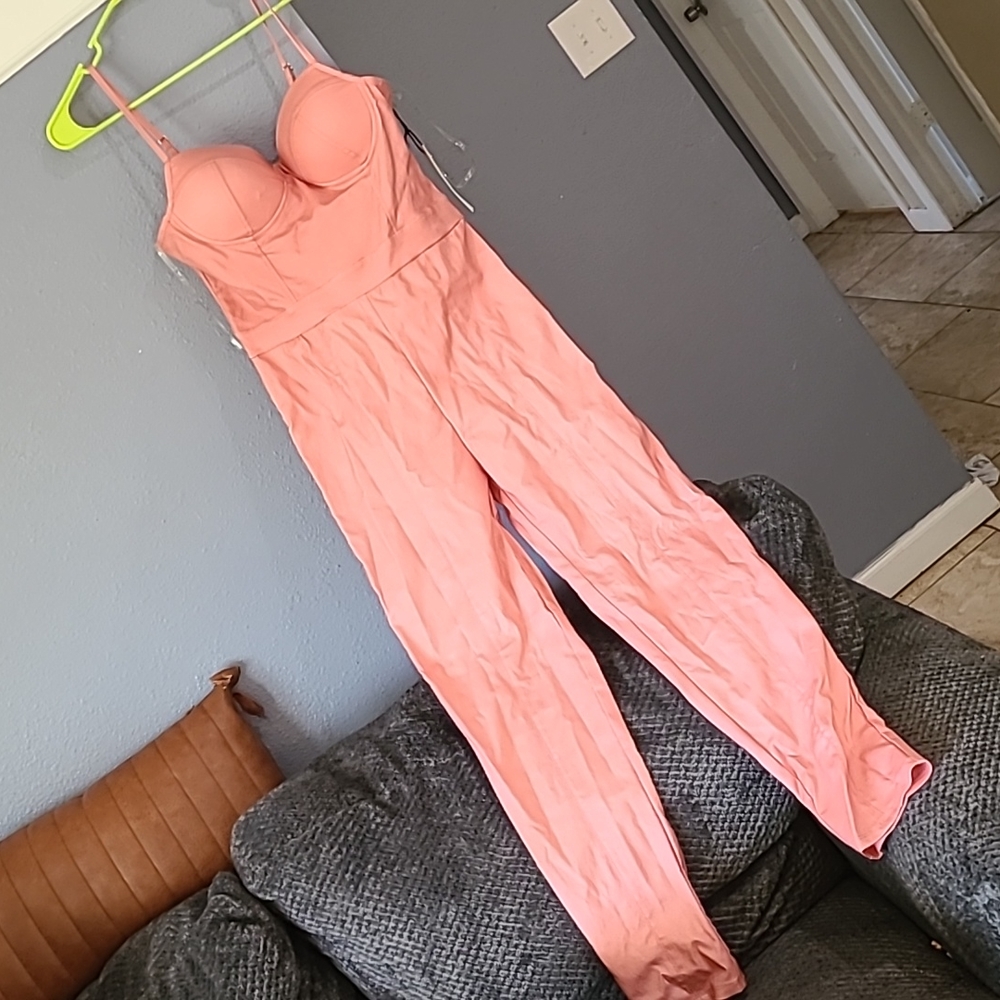 Never worn with tags body  Suit coral colored SOLD SOLD
